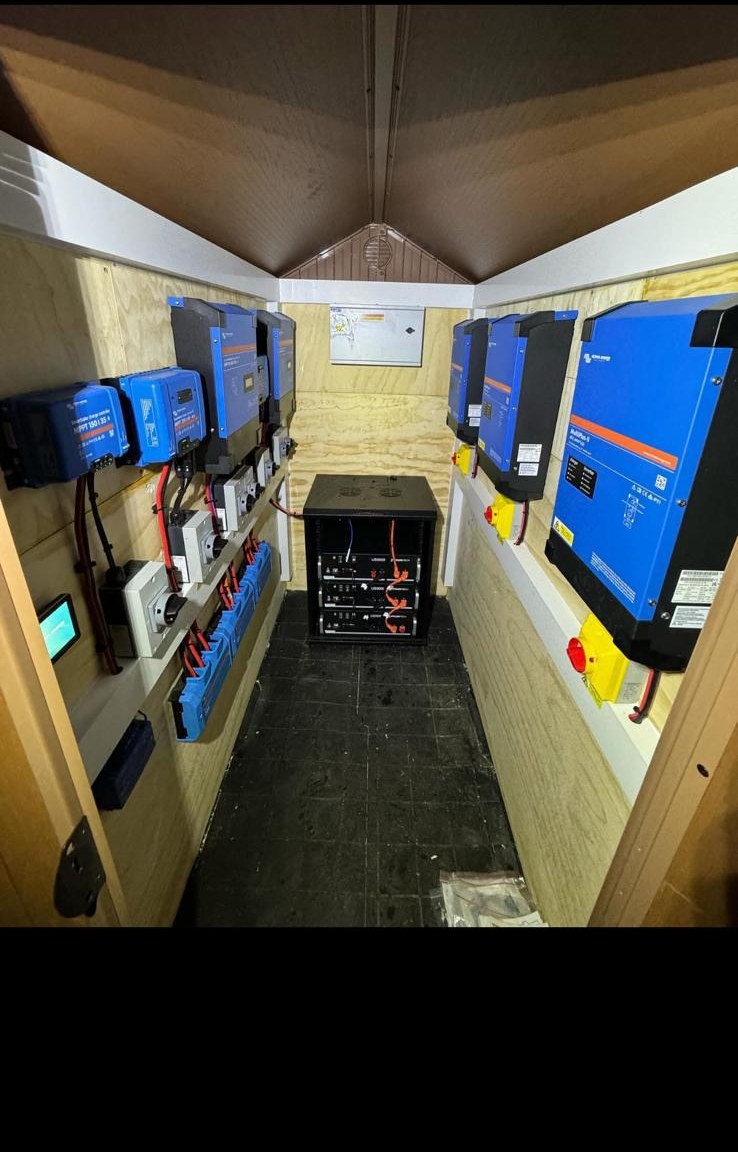 Victron inverter equipment and batteries installed in a dedicated off-grid power room